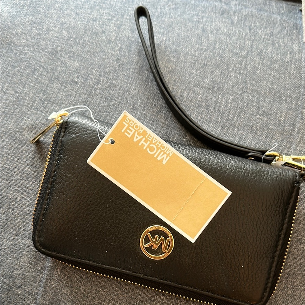 Michael Kors Black and Gold multifunction Wristlet. Authentic leather MK